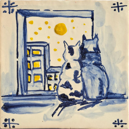  Two cats by a window with a moonlit sky