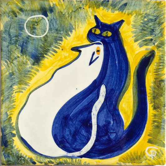 Two cats, white and blue