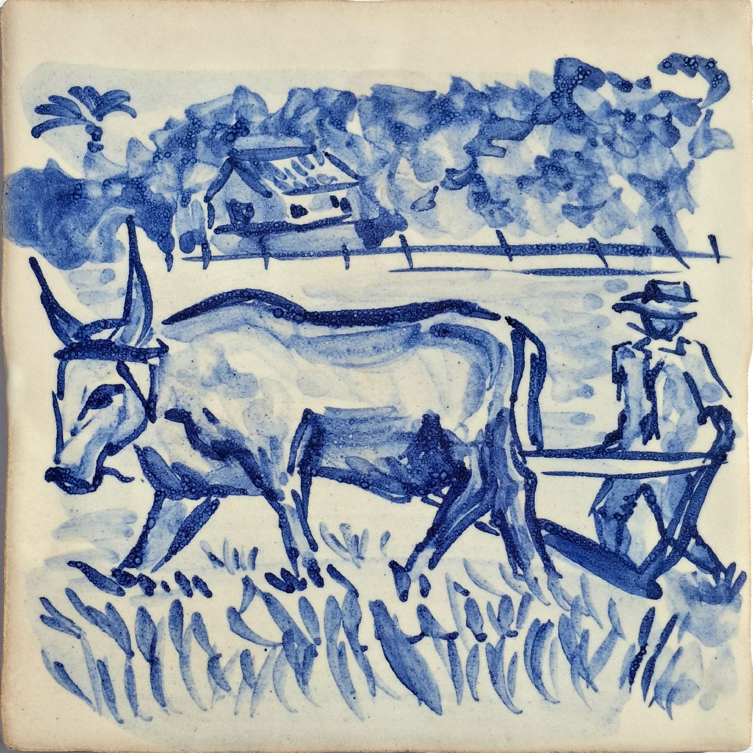 Rural scene of oxen pulling a cart with a person