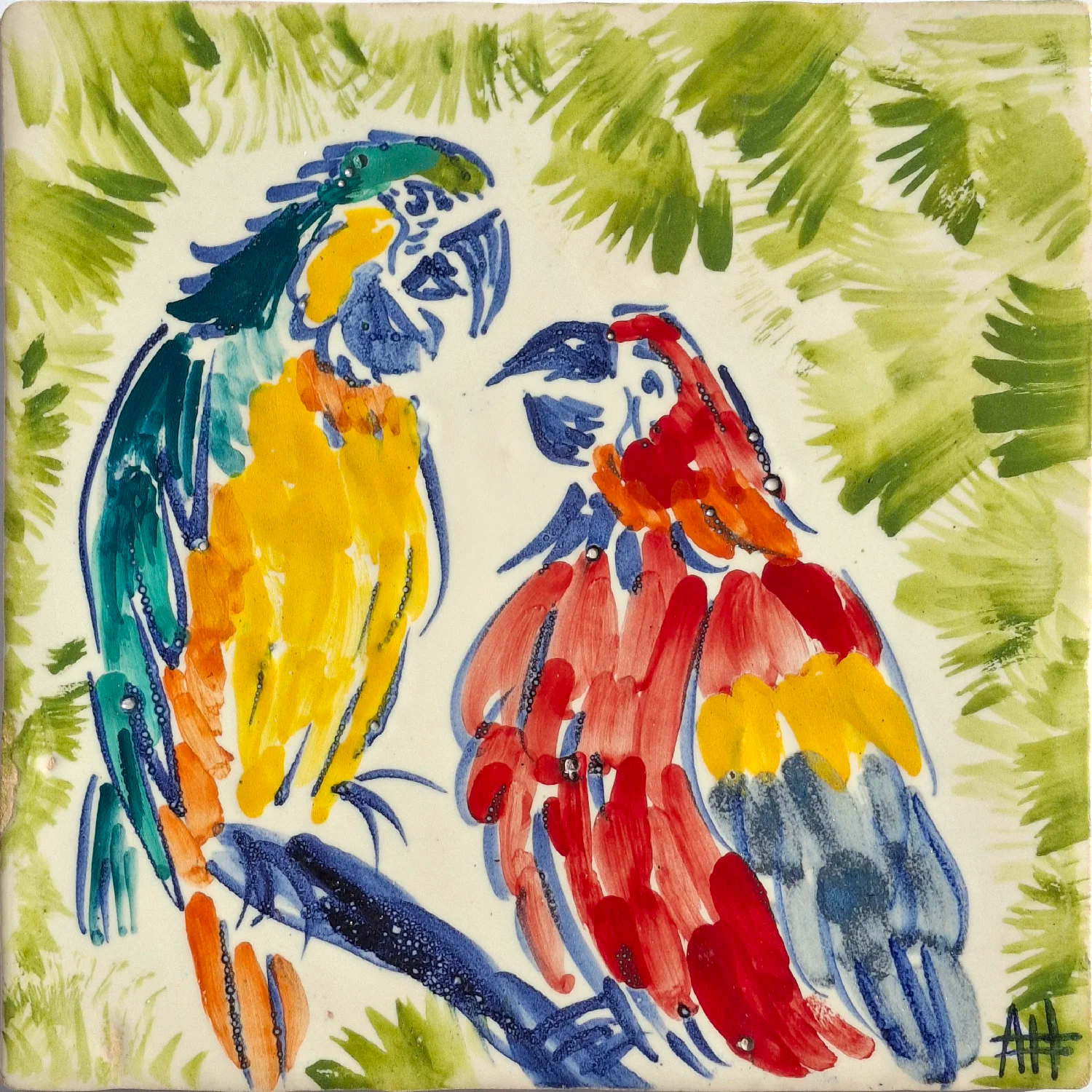 Two colorful parrots on a branch with a leafy green background