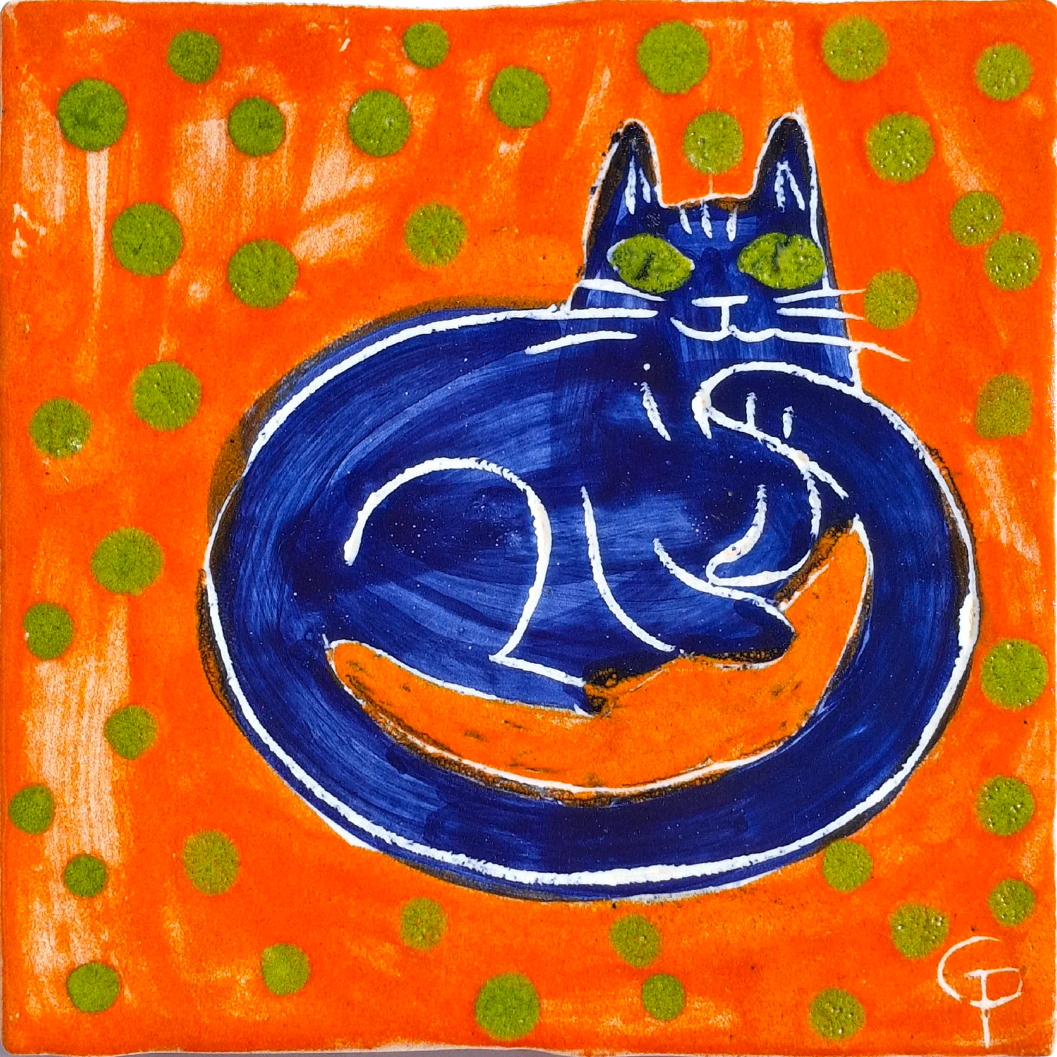 Blue cat on an orange background with green polka dots